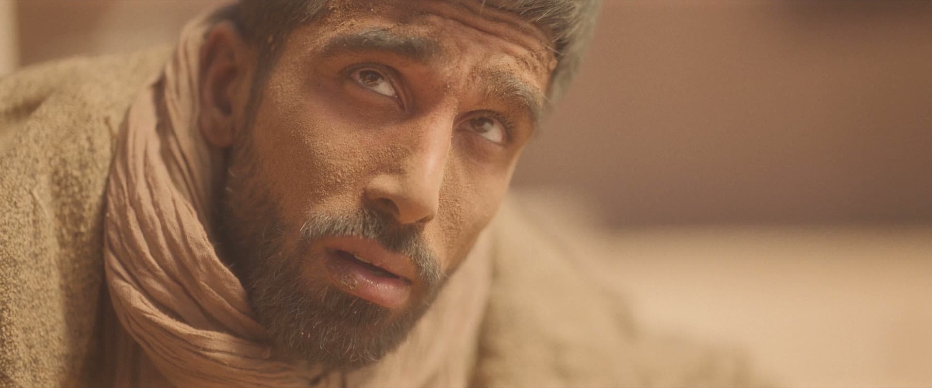 Dismas looking up in his final hours — a still from the film