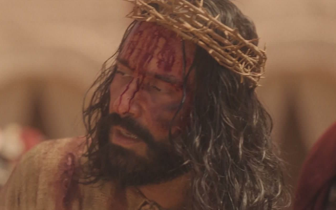 Jesus, crowned with thorns and bloodied, in a still from the film